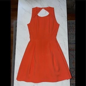 Bright orange fitted flare dress